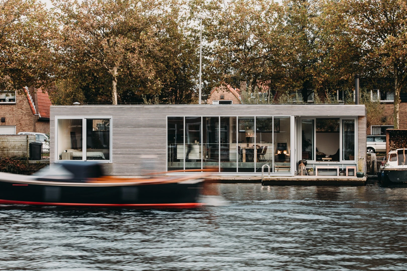 The 210-sq m (2,260-sq ft) home captures views across the river