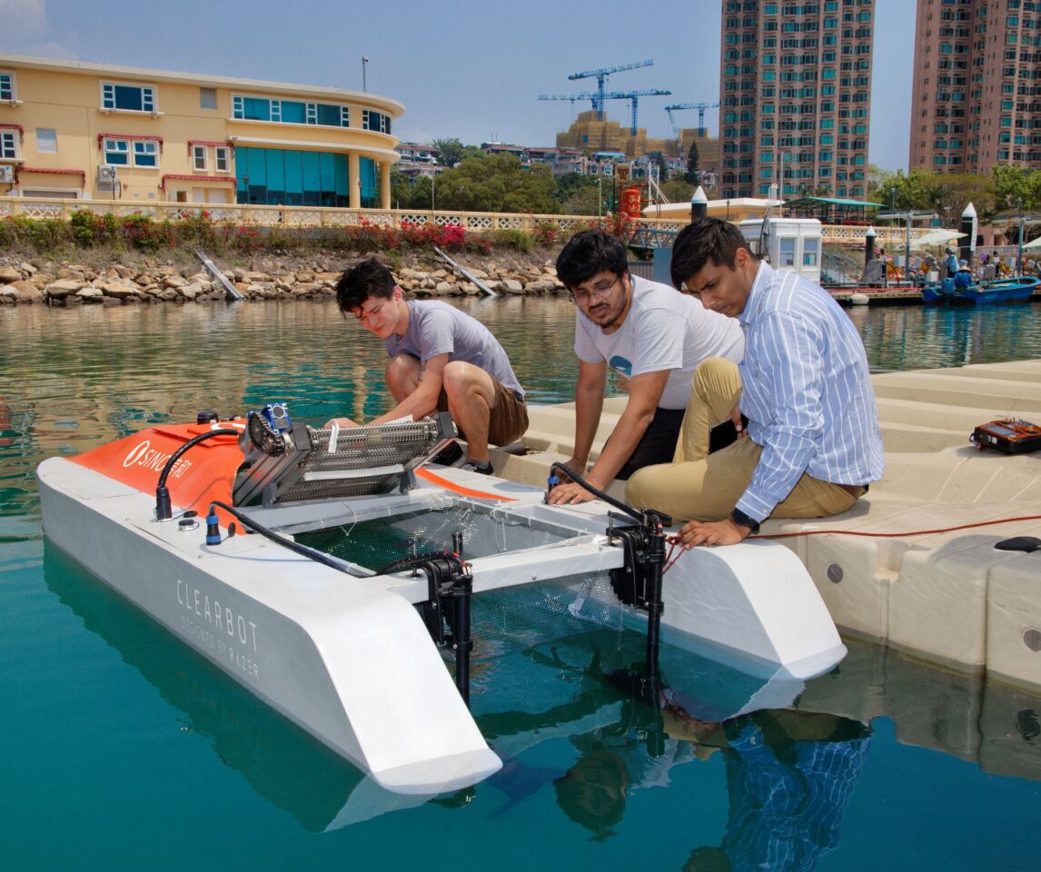 Founders Sidhant Gupta and Utkarsh Goel ready the Clearbot to begin operations at a Hong Kong yacht marina for the Sino Group
