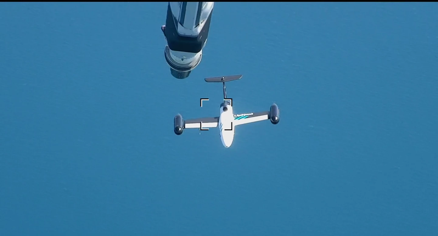 The drone was guided close to the tanker to simulate a refueling maneuver