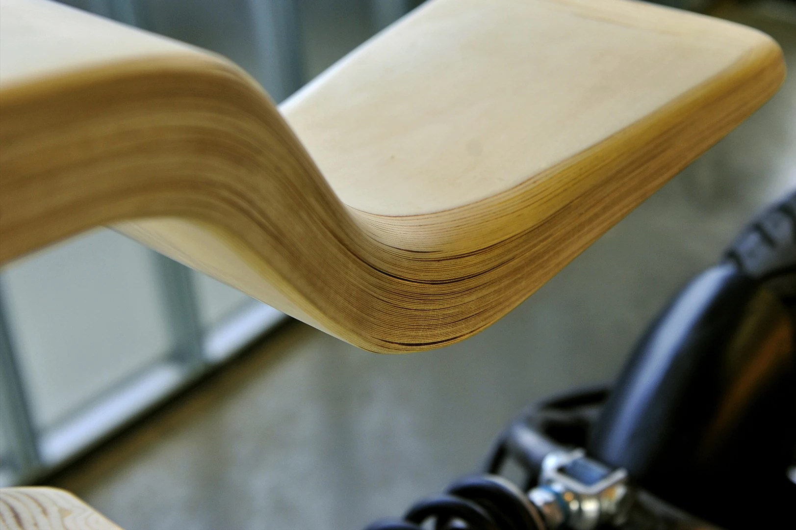 Martin Hulin's e-Raw electric motorcycle: seat unit is shaped from some 80 layers of wood laminate