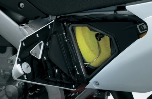 The airbox features a hinged lid for quick air filter access