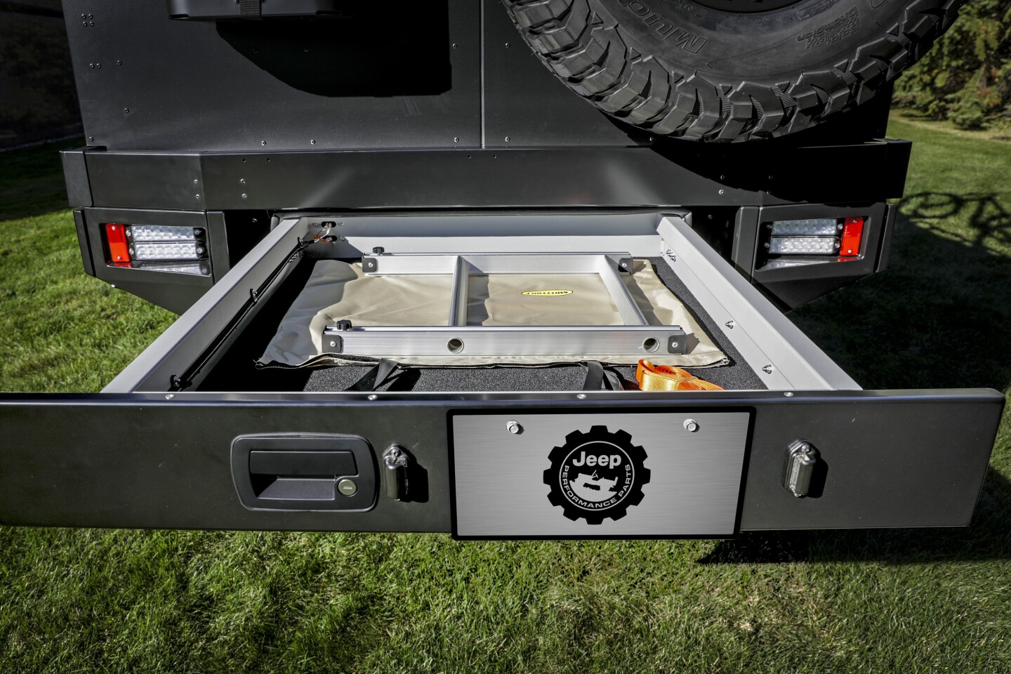 The rear bumper drawer houses a ladder for accessing the bikes on the roof