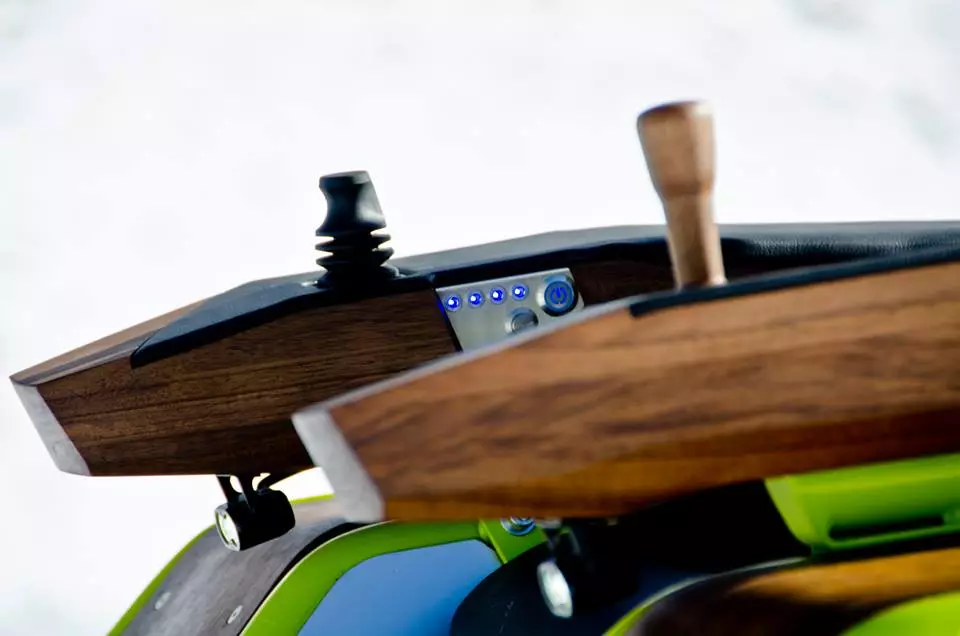 Steering is managed using a single armrest-mounted joystick