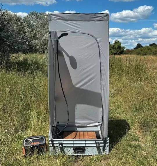 PlugVan recently released the 2.0 version of its expandable bathroom, which packs smaller and lighter, then expands into a fabric shower/toilet tent