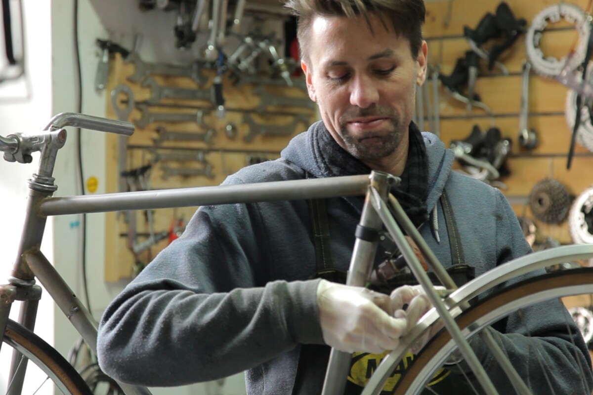 A former car transmission belt serves as a chain