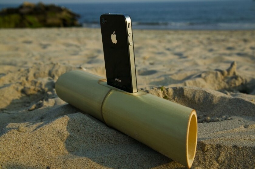 Anatoliy Omelchenko's iBamboo - a machined, laser-cut and hand-finished iPhone dock that's said to increase the volume and improve the audio quality of the sound coming from the smartphone's own built-in speaker