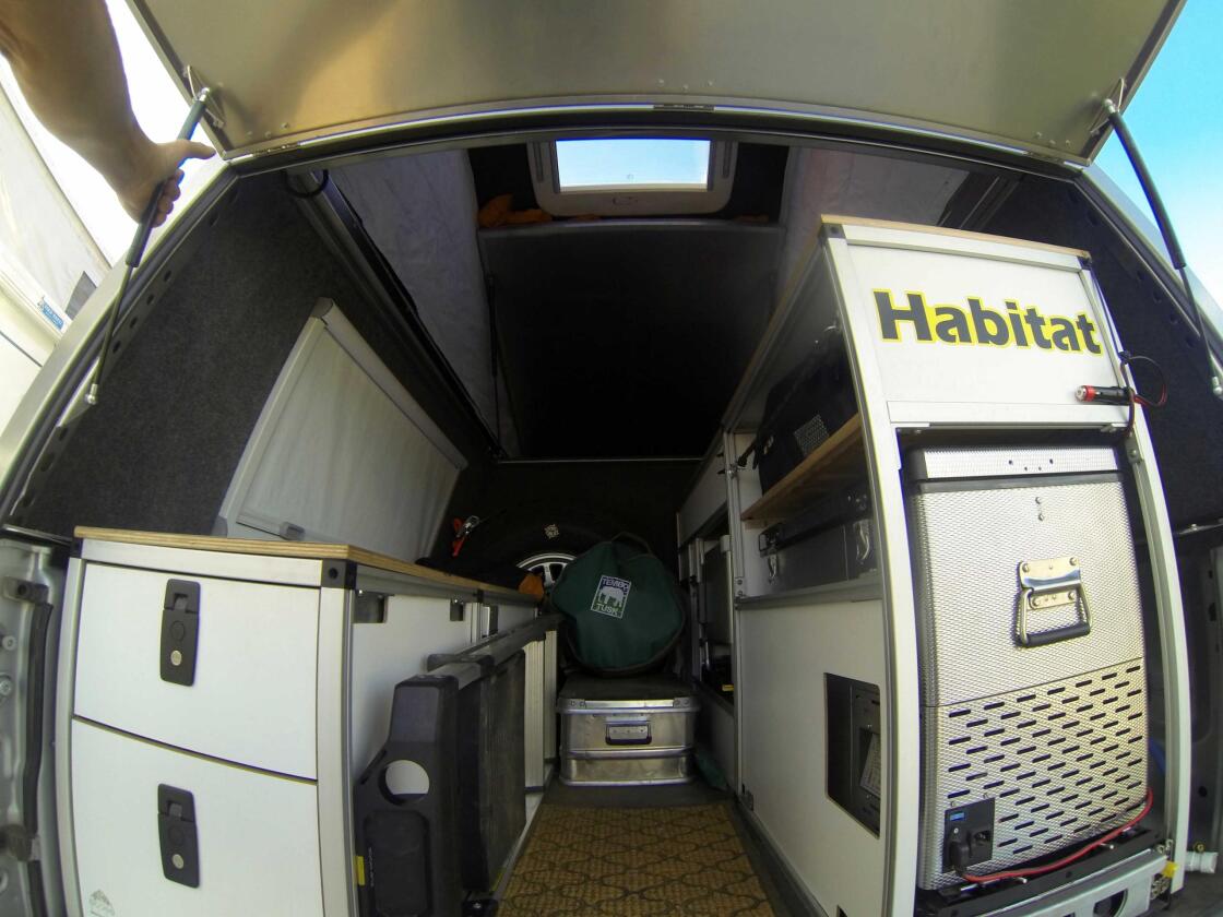 Buyers can leave the interior open for storage or build it up into a more functional camper, as seen in this Tacoma Summit with kitchen gear, storage and more