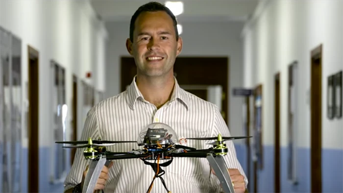 University of Bristol researcher Dr Tom Scott with a landmine-hunting drone