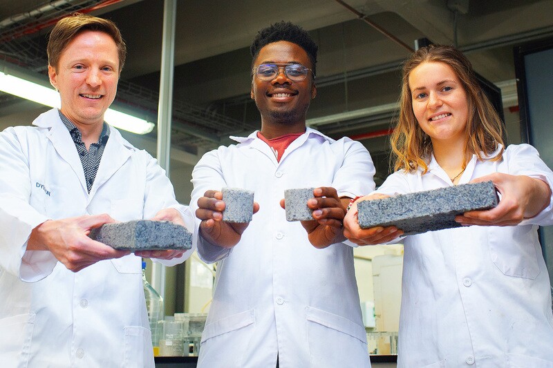 Dr Dyllon Randall, left, supervised the research leading to the bricks made with human urine