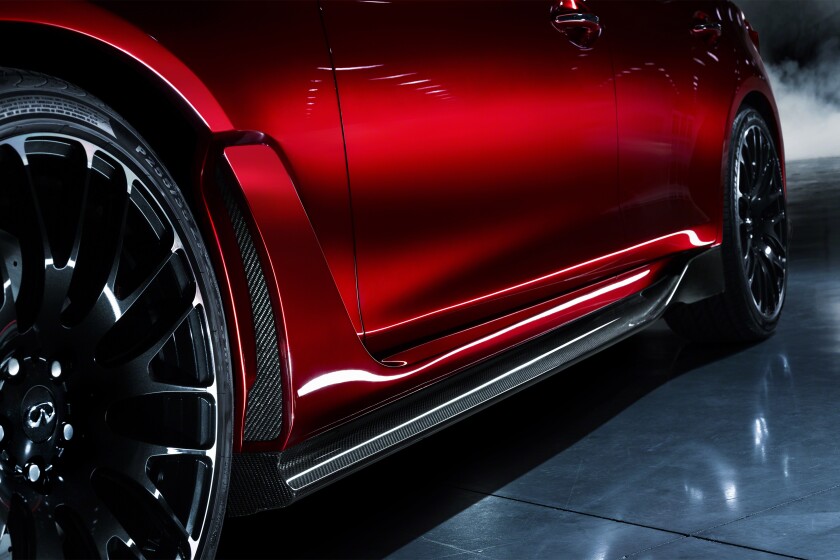 Down at ankle level, new carbon fiber sculpted aero-sections run the distance between the flared arches and 21 inch forged wheels