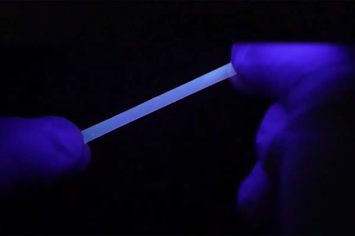 The polymer fluoresces under ultraviolet light, when stretched