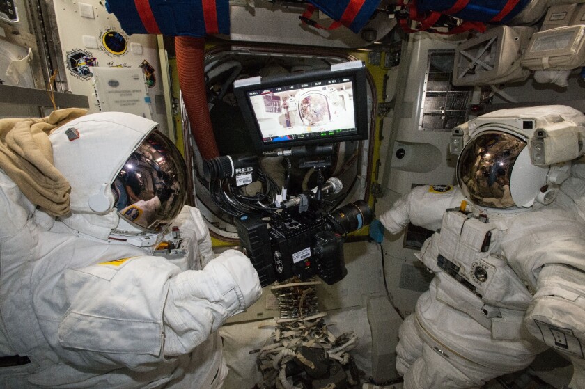 The RED Epic Dragon camera imaged between two NASA ExtraVehicular Mobility Units (EMUs)