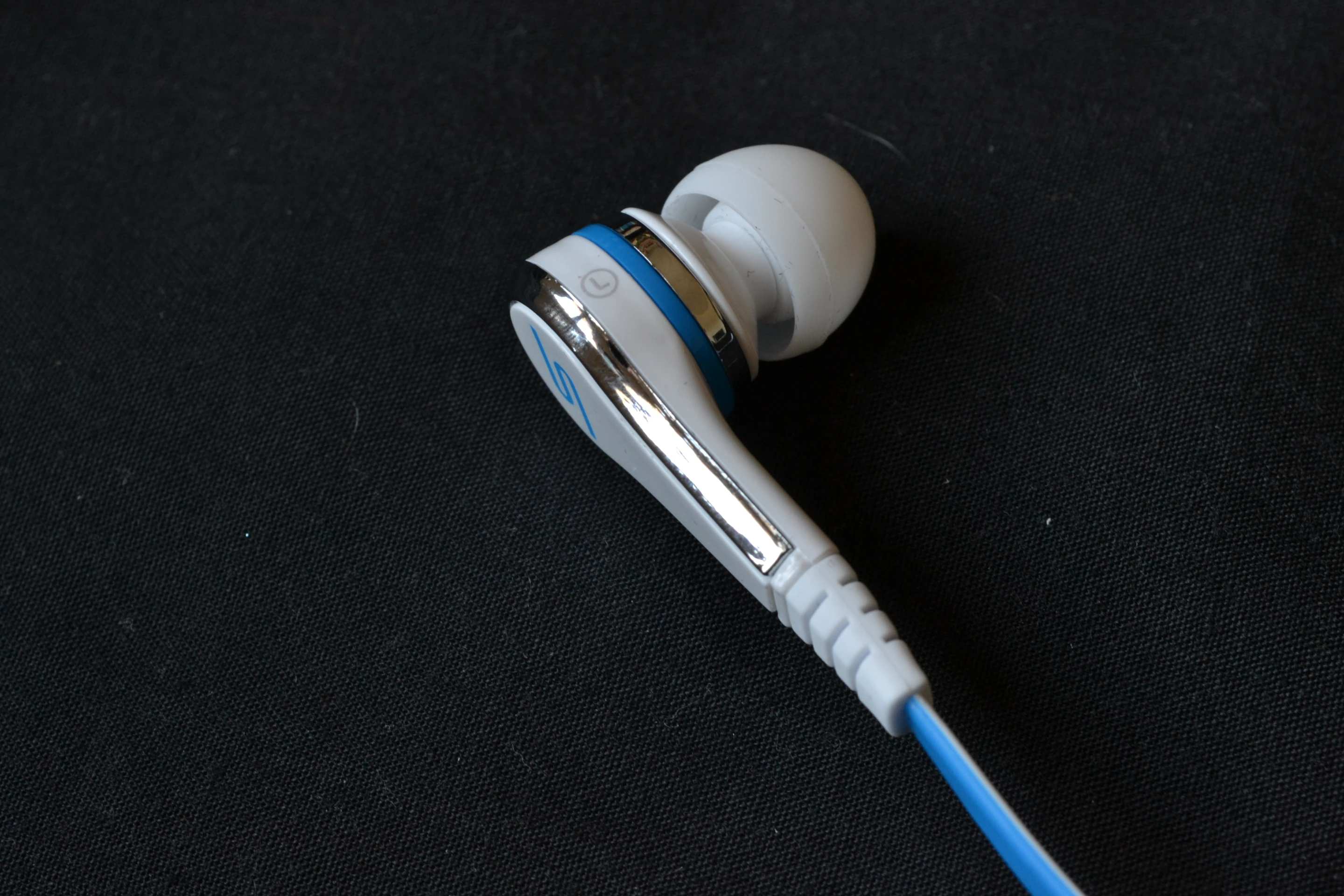 Of mostly ABS plastic construction and sharing design elements with their bigger brothers, the pure white is complemented by shiny chrome/silver finish that's tastefully interrupted with blue