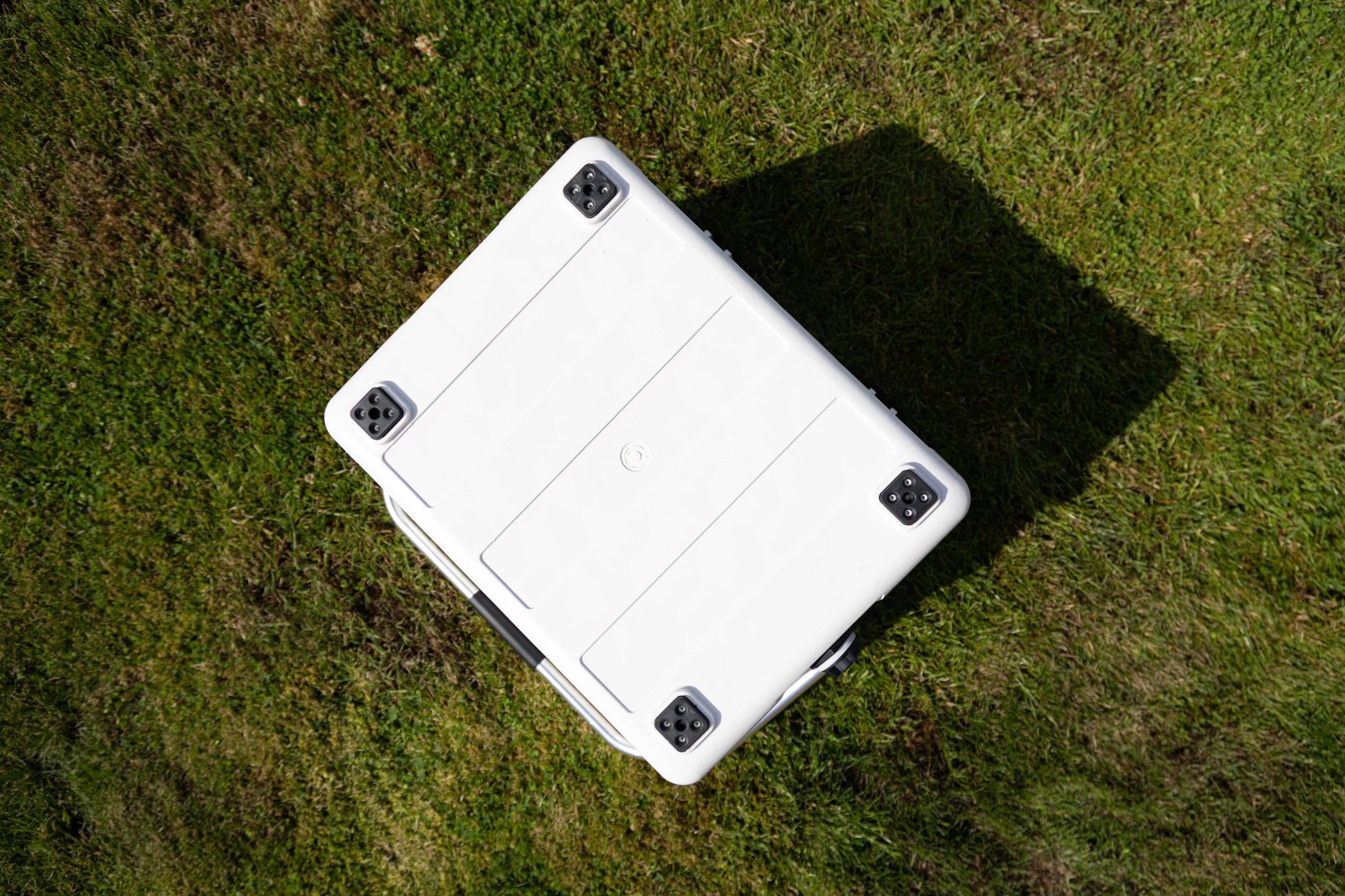 Non-slip feet stabilize the cooler when it's on the deck of a boat, floor of a van or other places it might slide around