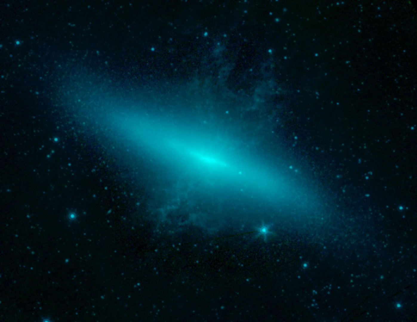 The supernova SN 2014J is seen in this image near its peak brightness in the first week of February 2014. It appears as a faint star to the lower right of the central region of its host galaxy M82