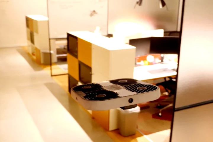 Protective screens keep the drone's whirling propellers away from employees' fingers