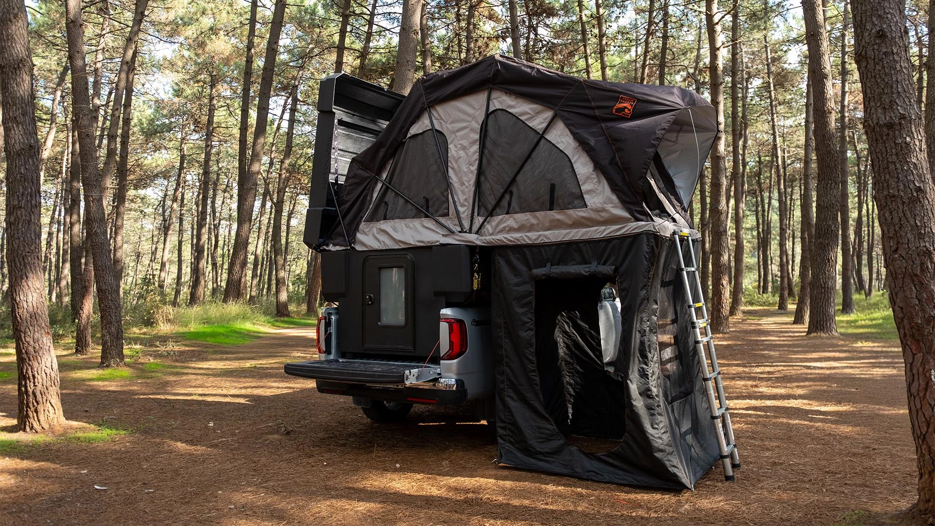 The Atlas includes a rear door to duck inside and a ladder to directly access the tent bed