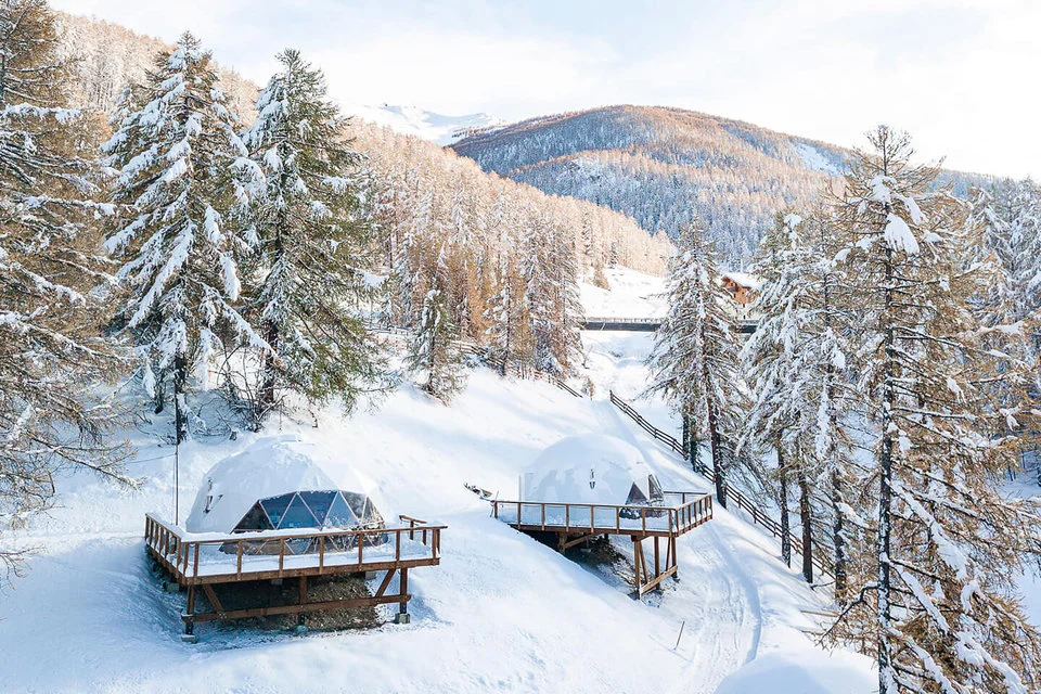 The geodesic cabins are built on a slightly raised timber platform, reducing their footprint on the landscape