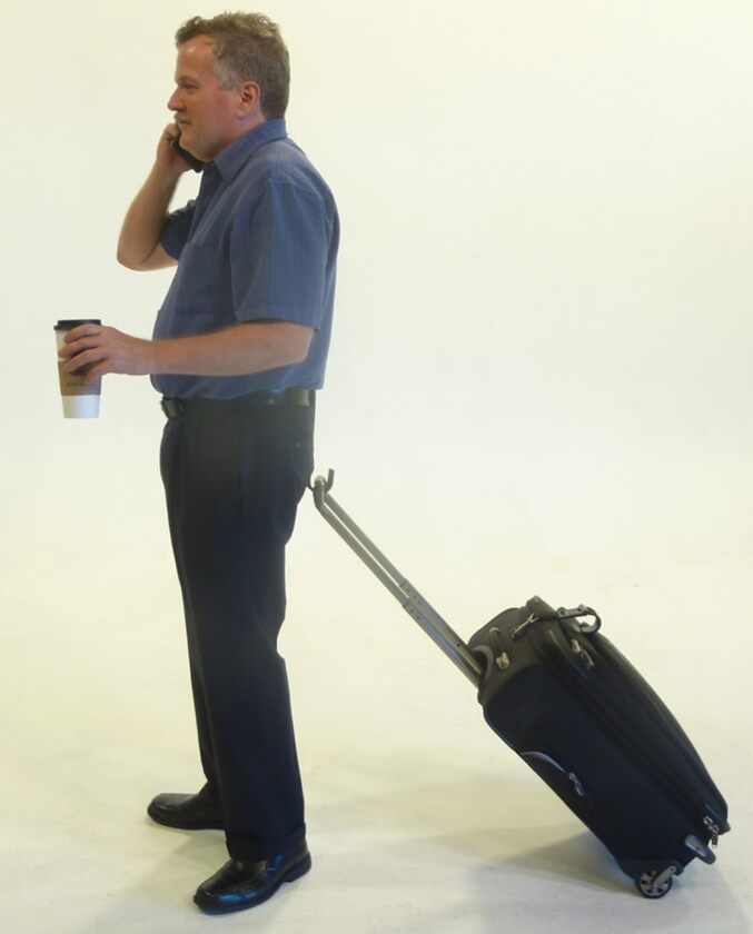 The My Hitch hooks onto your waistband to let you drag your luggage around behind you