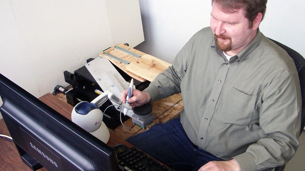 University of Utah mechanical engineer Will Provancher uses his right hand to demonstrate the Active Handrest (Image: The University of Utah)