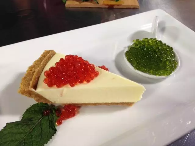 Black currant and mint pearls made with the Spherificator