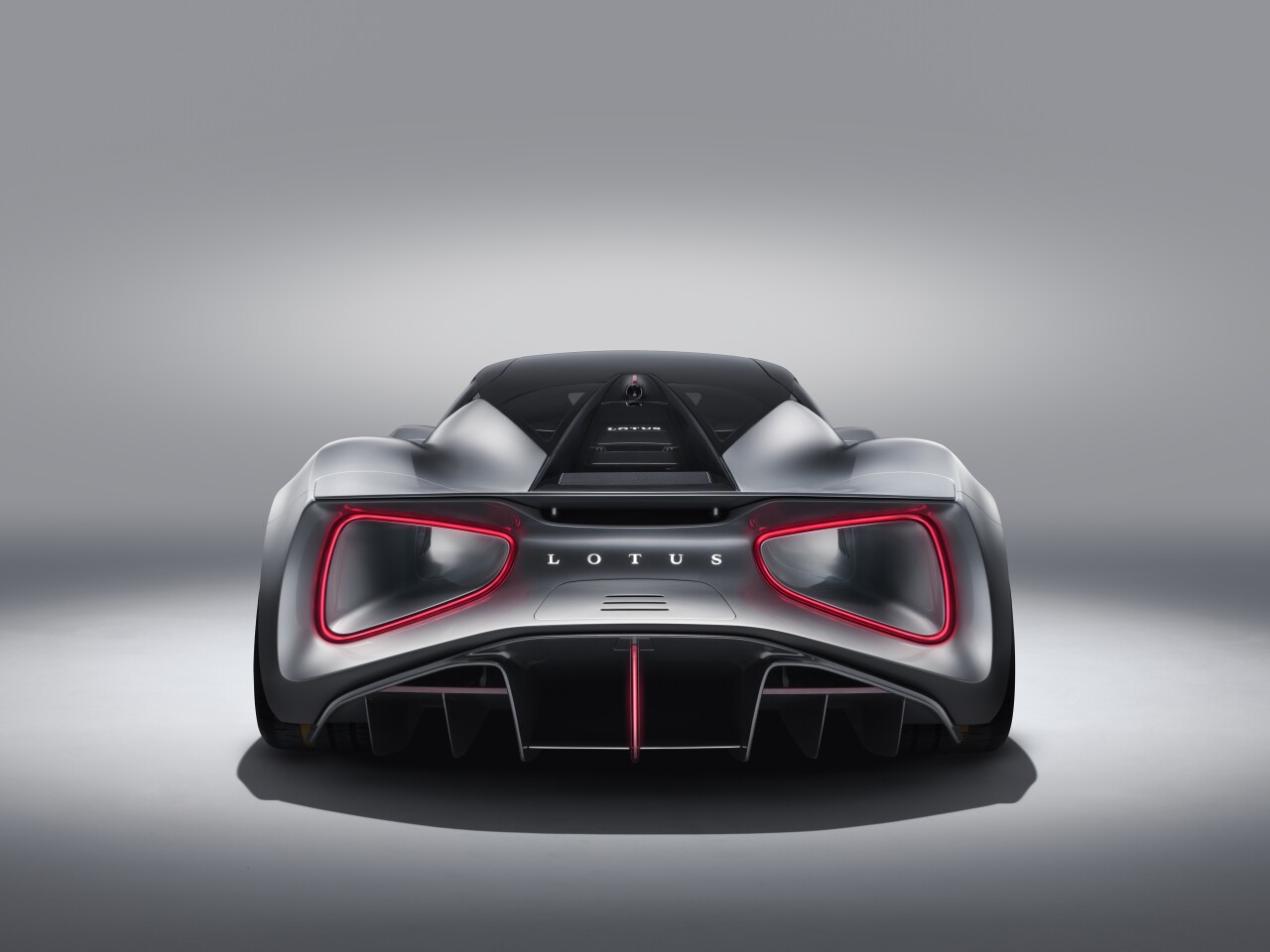 On the Lotus Evija giant venturi tunnels exit at the rear, rimmed by the taillights