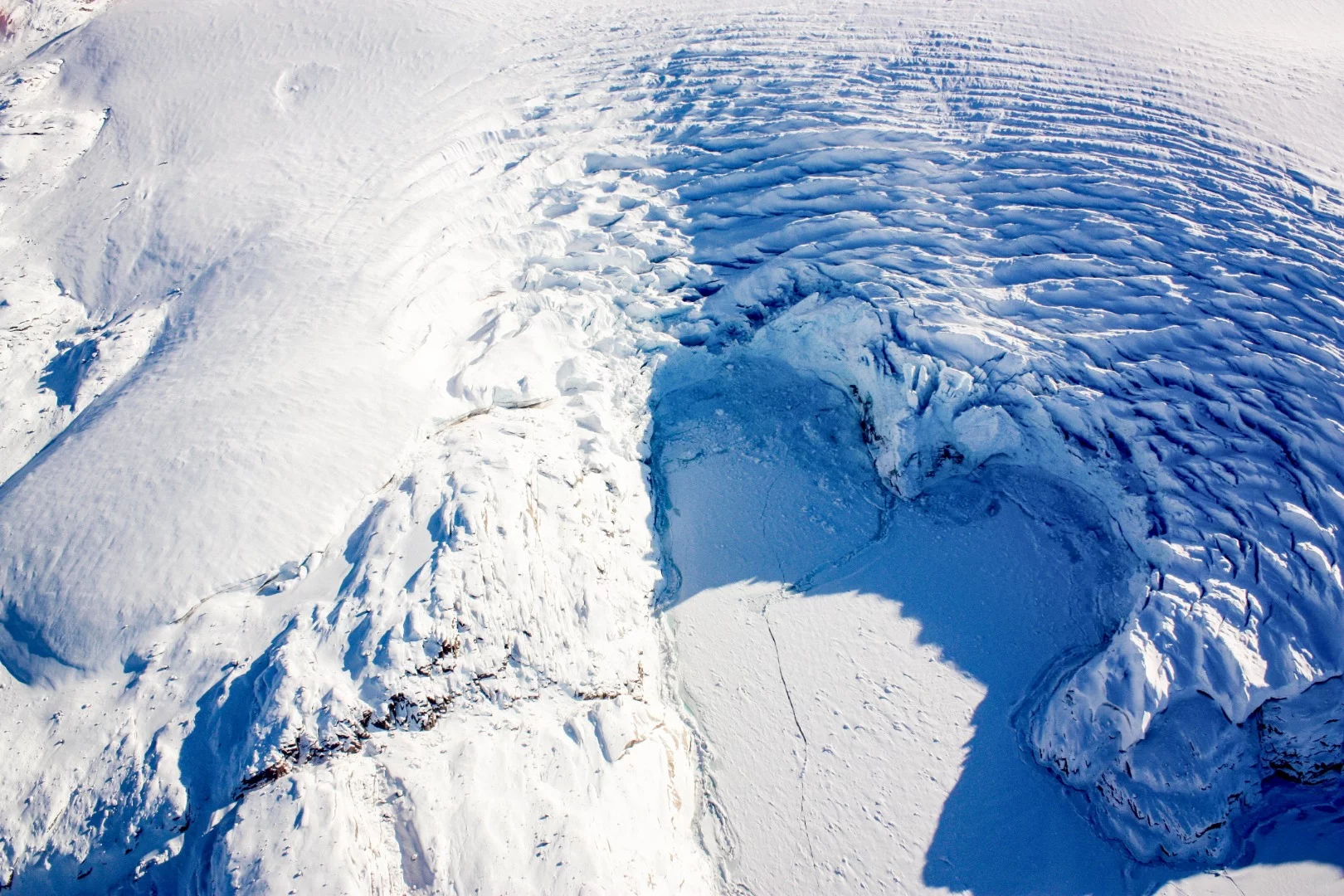 A heart-shaped calving front of a glacier in northwest Greenland, as seen during an Operation IceBridge flight on Mar. 27, 2017