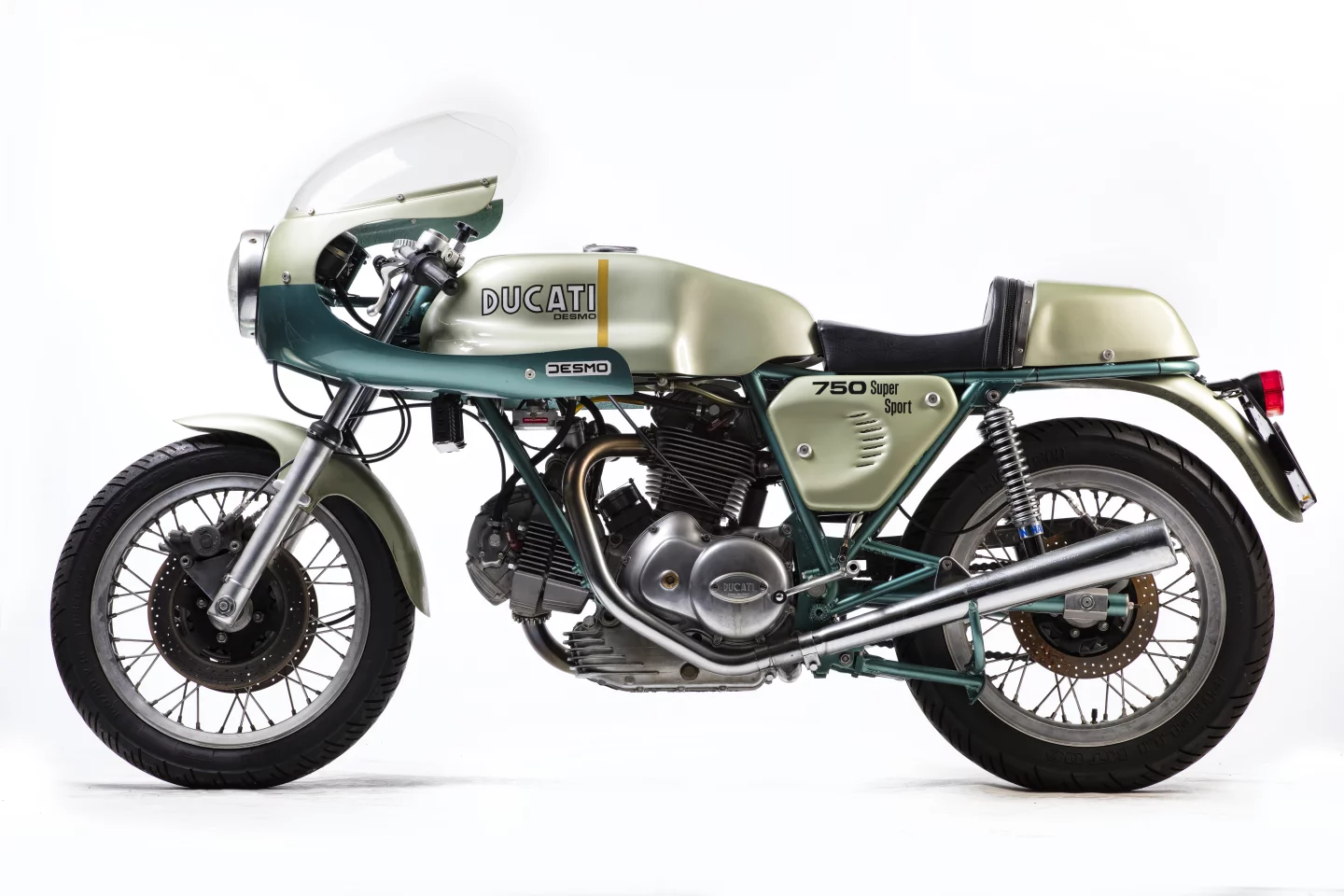 Slightly compromised in that it is not a matching numbers bike, the bike is regardless one of the original 401 examples of the green-framed 72 hp Desmo 750 SS which was produced to celebrate the Ducati 1-2 victory of Paul Smart and Bruno Spaggiari in the 1972 Imola 200 Mile race. That non-matching engine number cut $100,000 from the price, as a new world record for the 750 SS was achieved just a month ago when Gooding & Company sold a near identical 1974 Ducati 750 Supersport for $176,000, beating out the previous record of $152,885 (sold for €114,371) set at the Paris Retromobile auctions in February, 2013 by Artcurial. The bike (Lot 574) sold for £52,900 ($68,923).