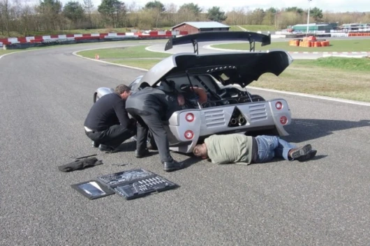 Mechanics make minor adjustments at the shakedown