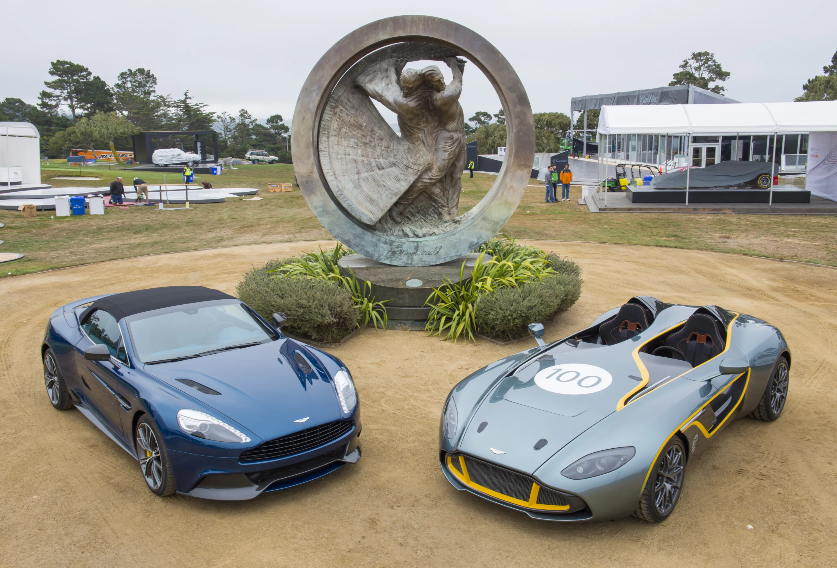 Aston Martin's 2014 Vanquish Volante (left) global debut at Pebble Beach as the CC100 Speedster Concept made its first appearance in the US (Credit: Kimball Studios, courtesy Pebble Beach Concours d'Elegance)