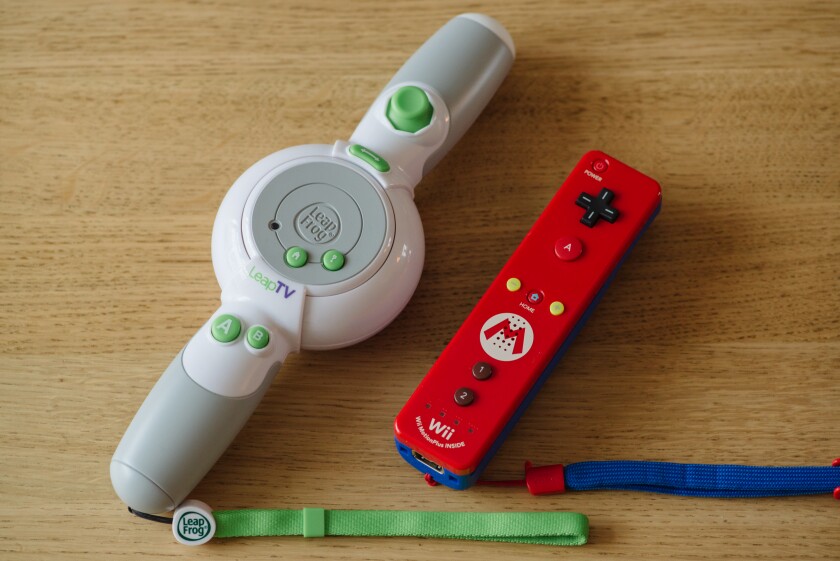 The LeapFrog LeapTV controller compared with a Nintendo Wiimote (Photo: Simon Crisp/Gizmag.com)