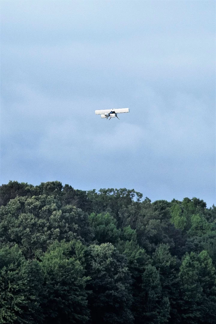 The VTOL X-plane hovering in place before transitioning to horizontal flight