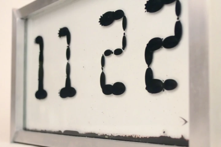 Ferrolic is a clock which tells the time by manipulating ferrofluid using electromagnets