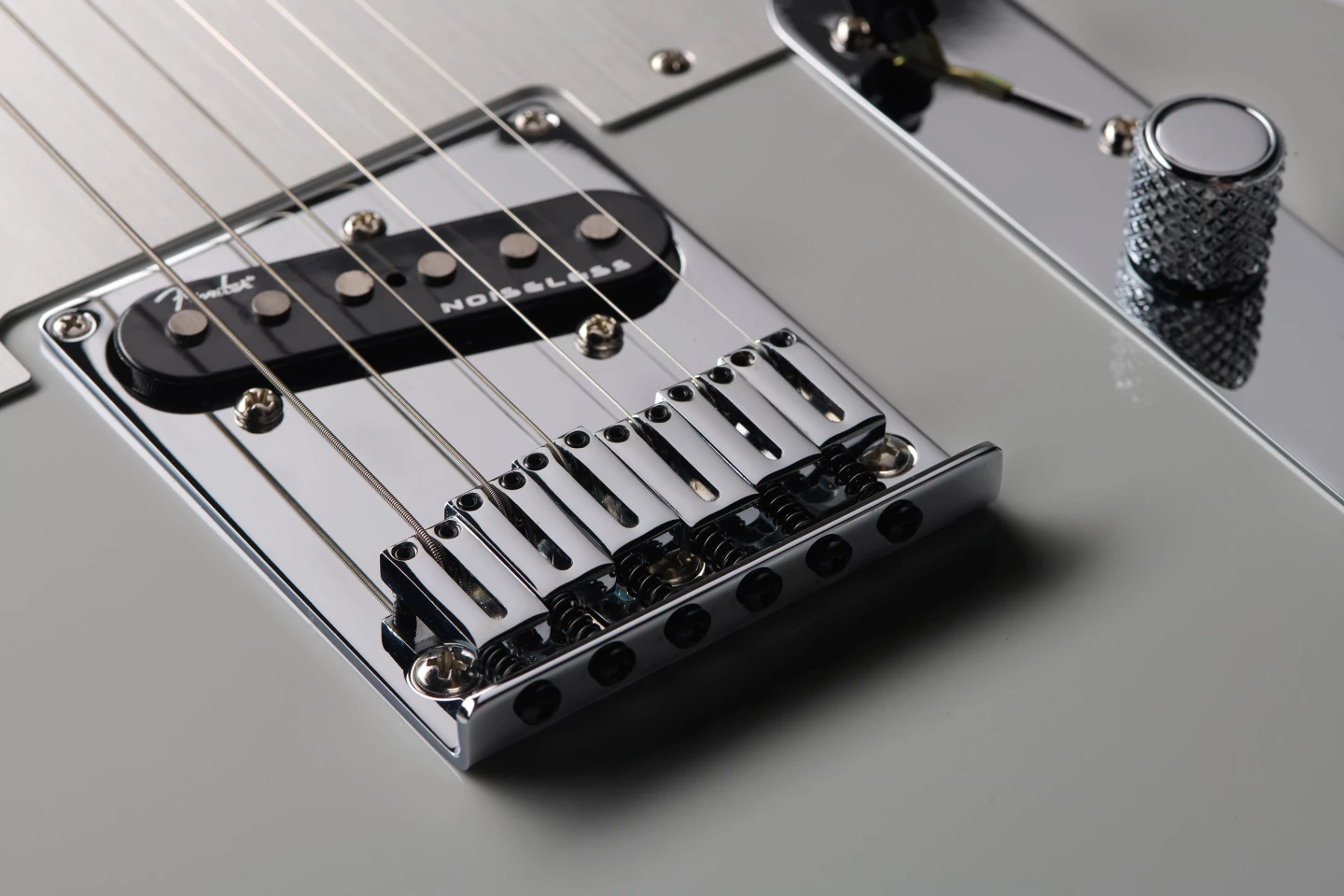 None of this three brass barrels and an ashtray business, the Ultra II uses chromed brass block saddles for individual intonation adjustment