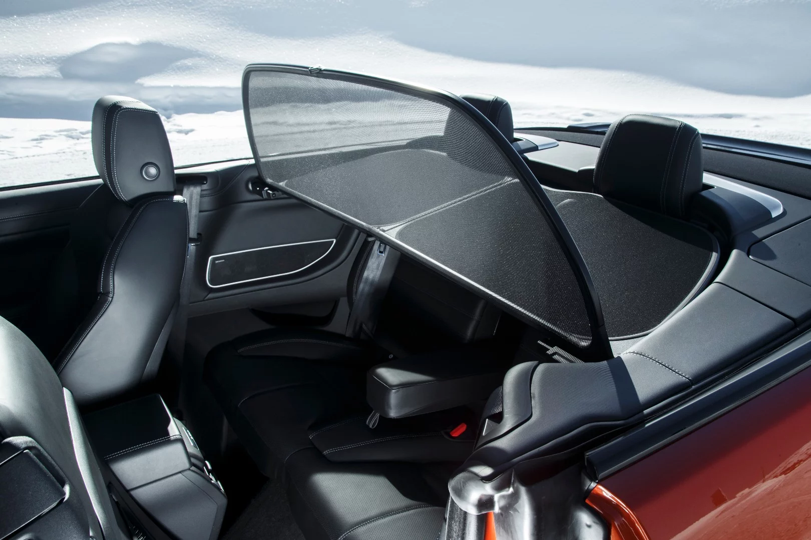 A windscreen helps cut noise when the top is down