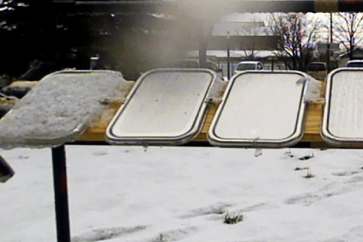 SLUGs coatings repel snow and ice on the right three panels, while it builds up on the far left untreated panel