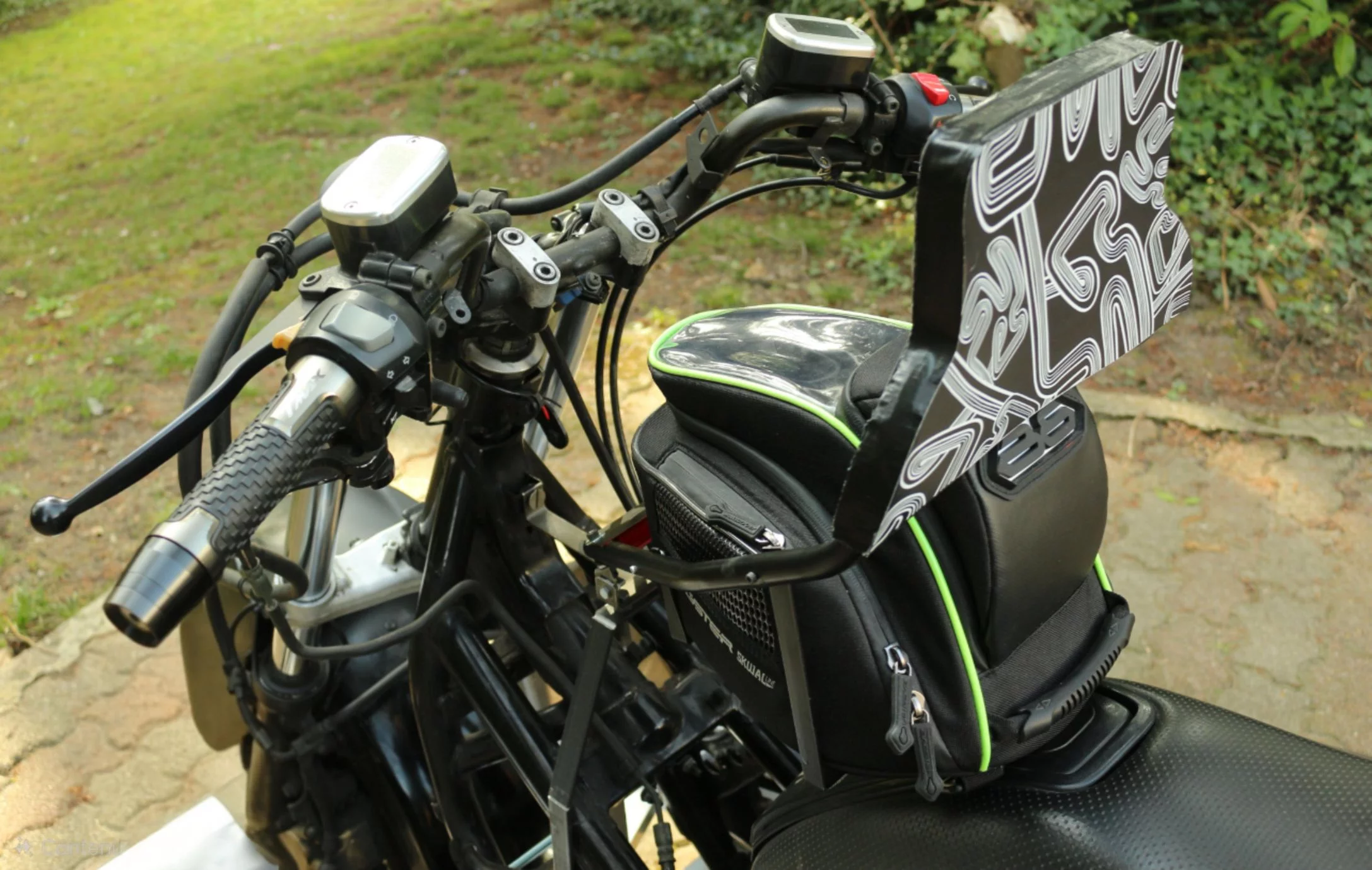 The PRD "partially" couples the rider to the chassis during a frontal impact, preventing a tip over