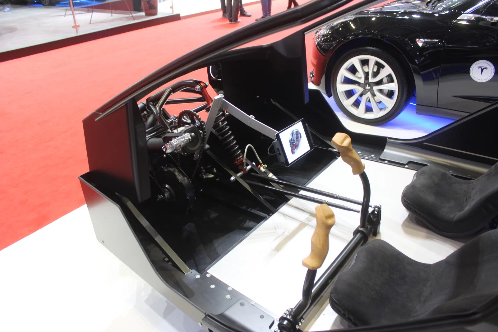 The odd steering handles and foot pedals of the human/electric powered Twike 5, which was shown in skeletal form at Geneva
