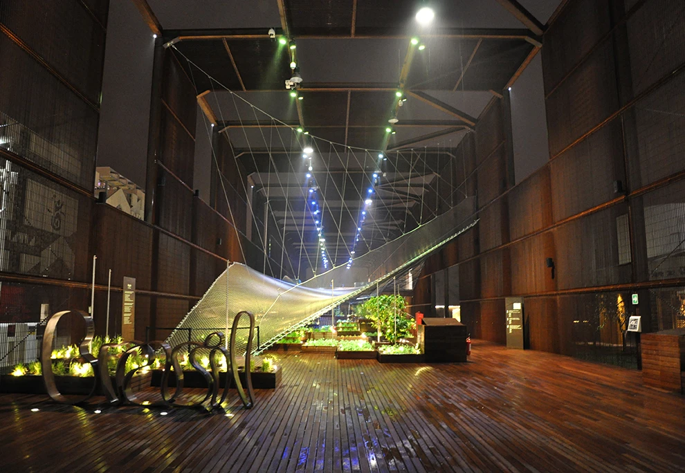 The Brazilian Pavilion features massive trampolines hovering above garden beds