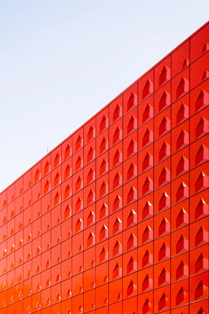 This photo of a bright red facade is by André Dogbey has a life all its own