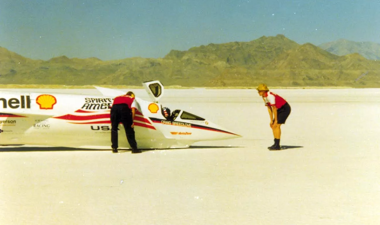 Chris Rossi, Craig Breedlove, and Dezso Molnar run final checks before launching the Spirit of America land speed car at Bonneville
