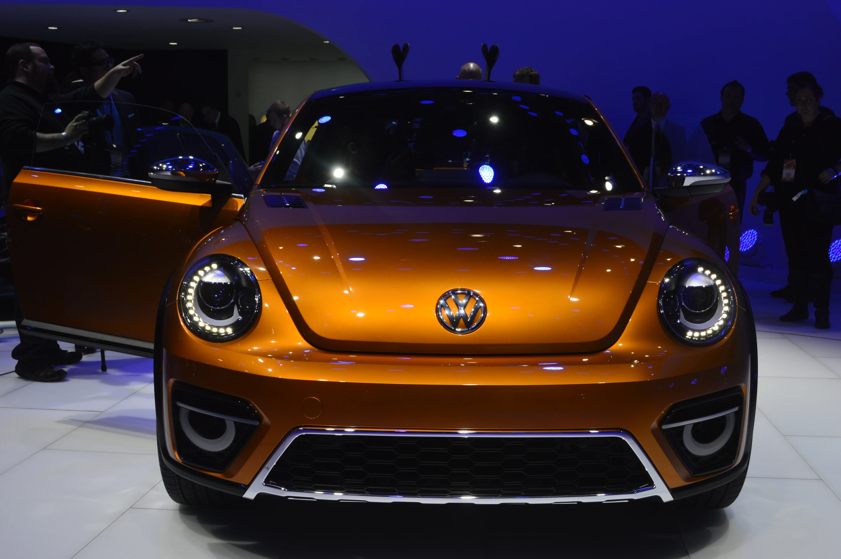 The custom hood has a raised center section flanked by air vents, beneath which is a central air intake and ring-shaped LED fog lights/turn indicators
