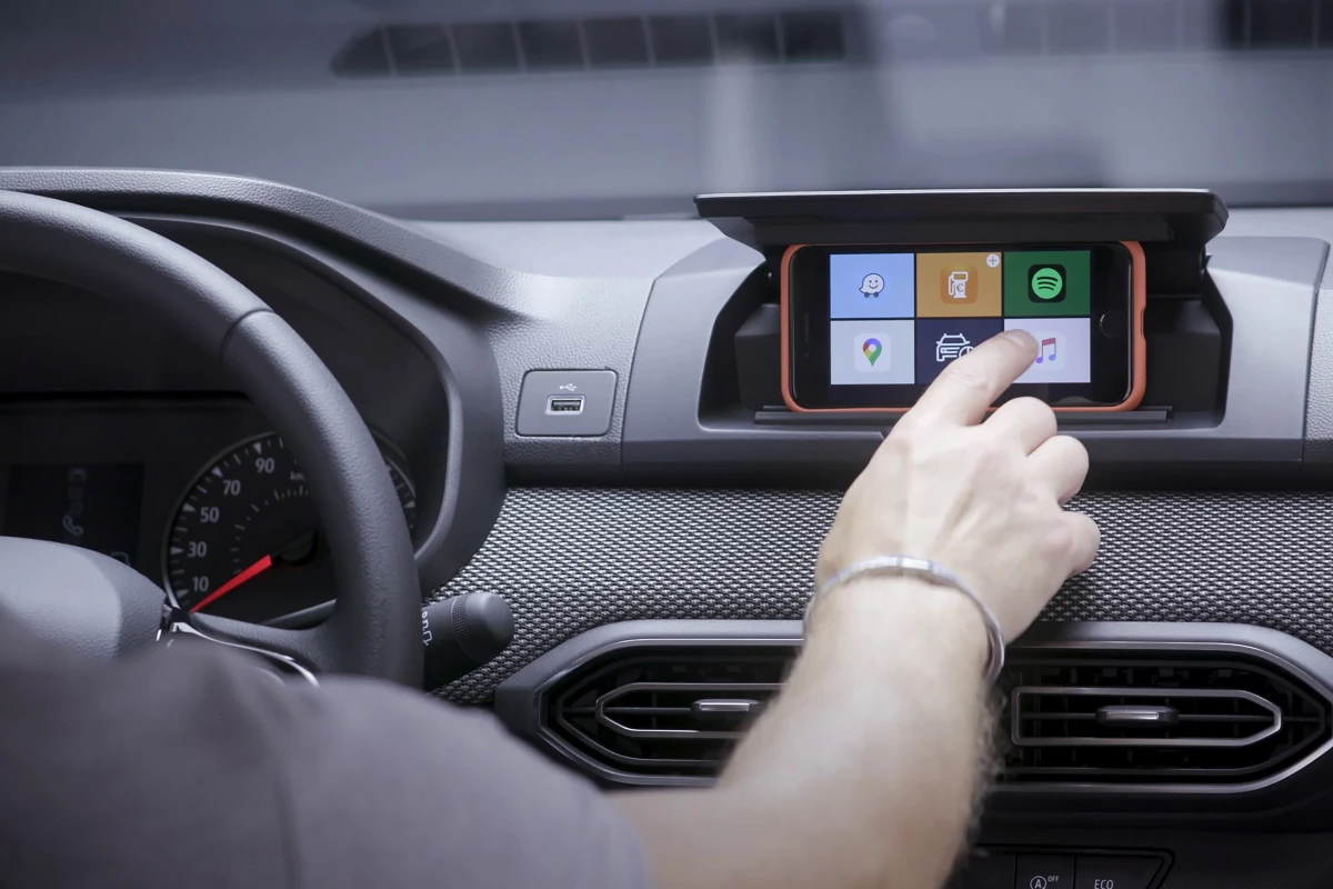 The Media Control system replaces a built-in infotainment screen with the driver's own smartphone