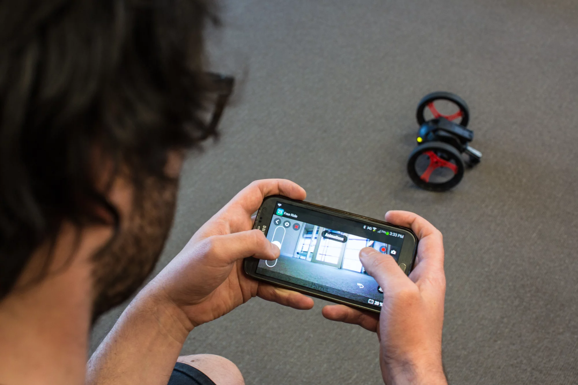The Jumping Sumo has a top speed of 7 km/h (4.5 mph) and is easy enough to start up with a slider on left of screen to control acceleration and braking (Photo Gizmag/Loz Blain)