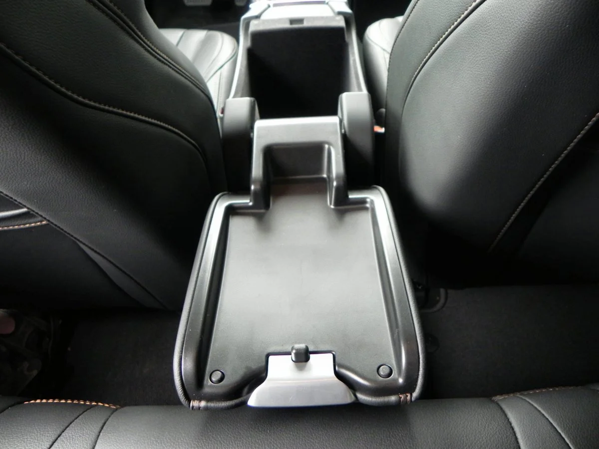 In the V60, the lid for the center console storage box flips all the way back to become a convenient tray for rear passengers