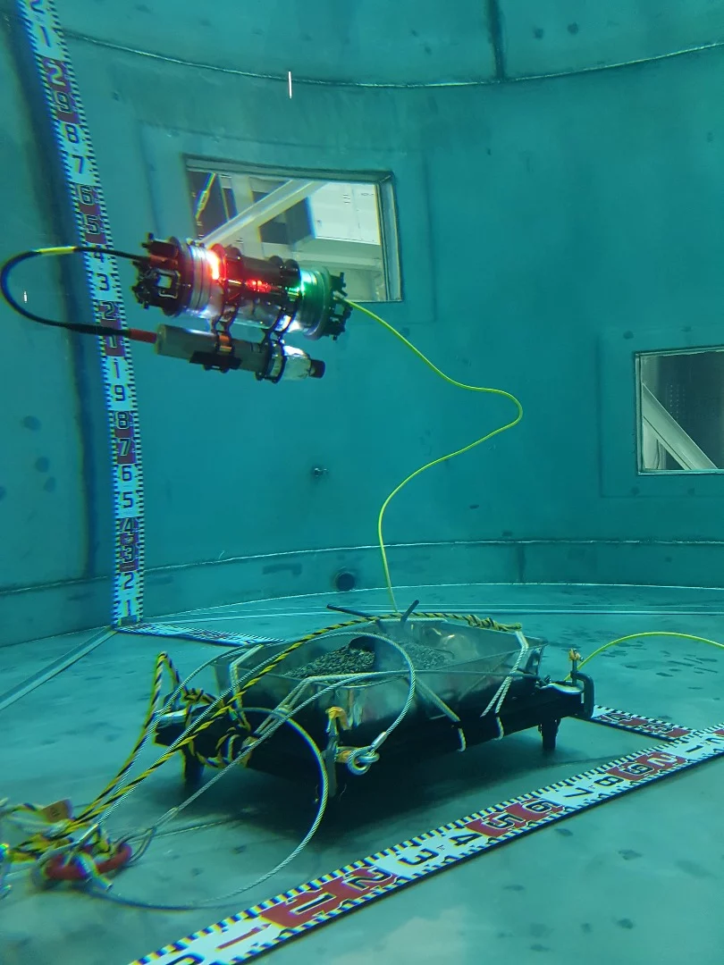 2nd place in the Equipment and Facilities category is this image of a Remotely Operated Vehicle (ROV) with an acoustic sonar, searching for simulated fuel debris at the bottom of a test pond. The research project is investigating how to localize and identify fuel debris within the Primary Containment Vessel (PCV) at the Fukushima Daiichi nuclear power plant