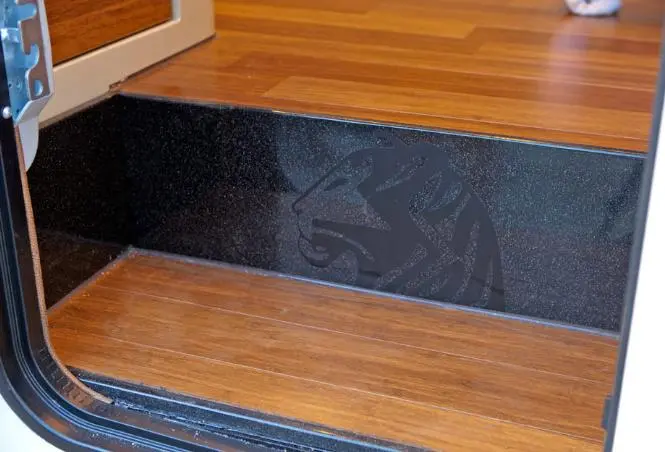 Tiger Adventures' logo etched subtly into the surface