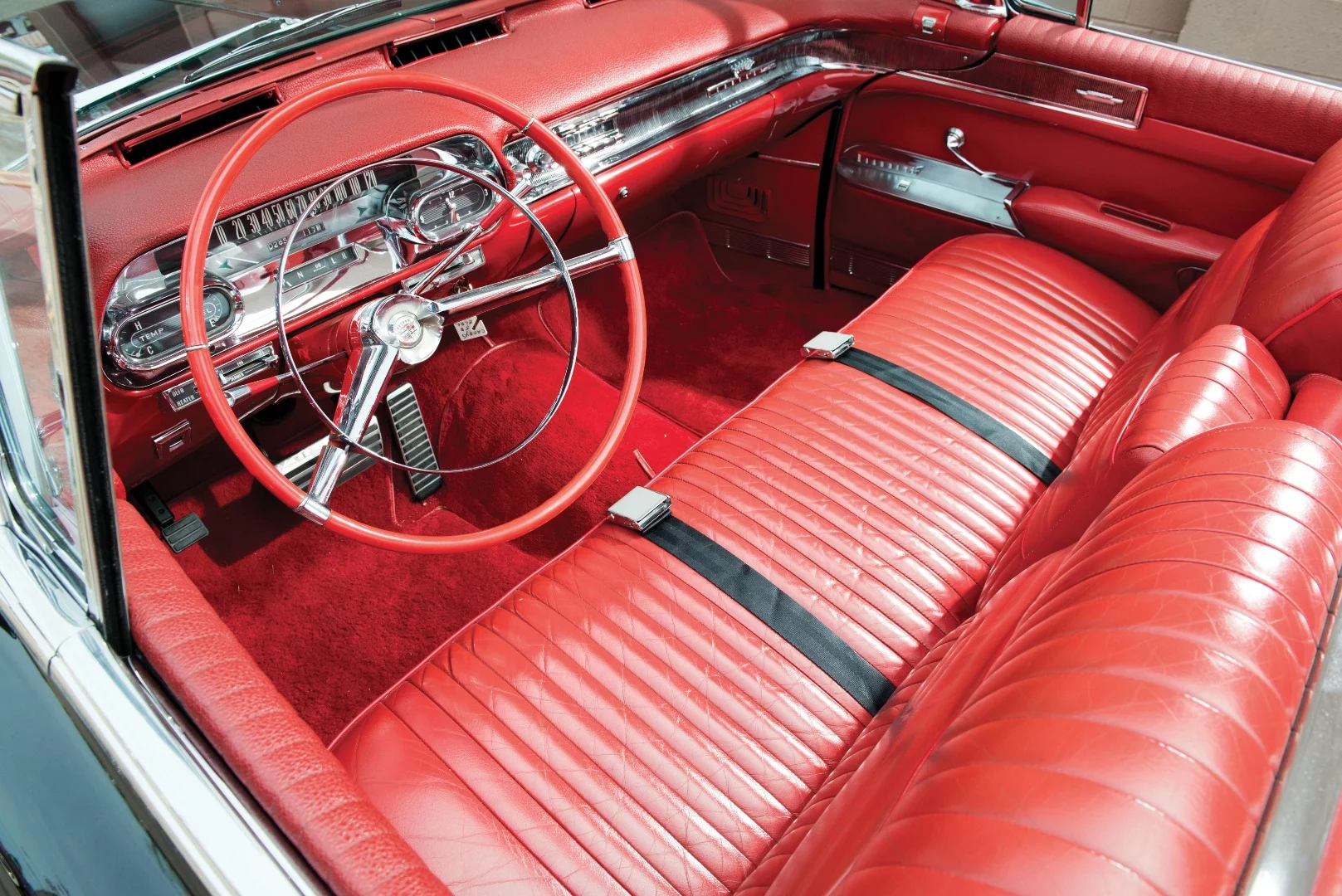 The chrome interior trim and red leather of the Biarritz are suitably brash