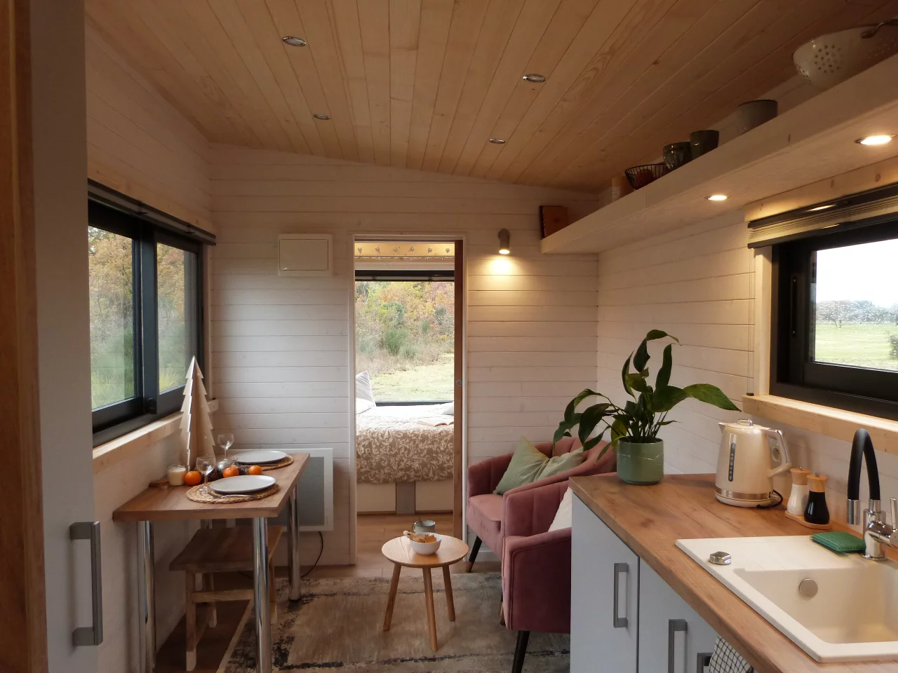 The Capucine's kitchen has a sink, an induction cooktop, and a small fridge