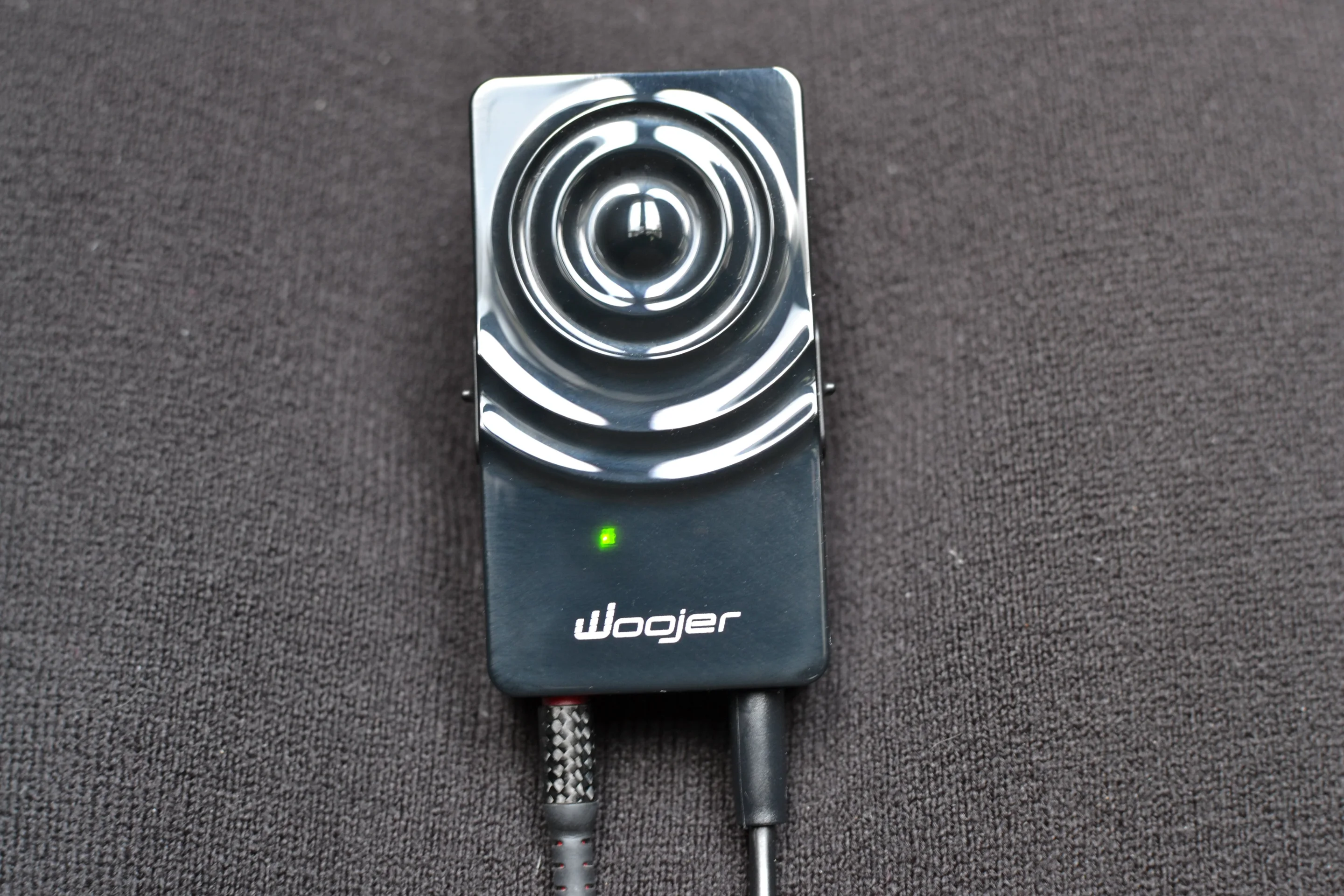 A user can hang the Woojer in the middle of the chest, with the magnet under the pullover or shirt and the device out front (Photo: Paul Ridden/Gizmag)